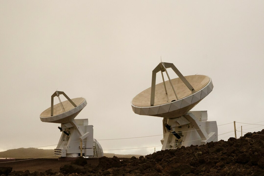 Large satellite dish pointing at a clear sky at a teleport